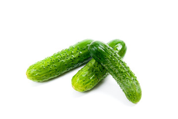Fresh green cucumber on the white background.