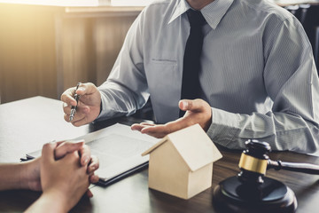Home loan insurance, Male lawyer or judge Consult with client and working with Law books, report the case on table in office, Law and justice concept