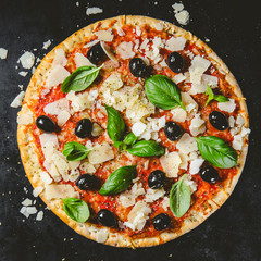 Traditional italian pizza on dark table
