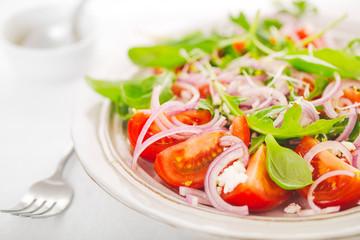 Summer fresh salad with tomatoes, cheese and onion