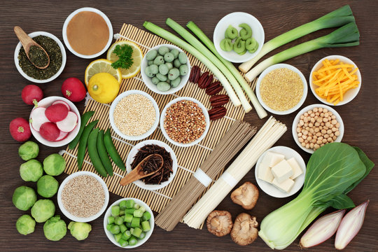 Macrobiotic diet food with japanese udon and sobu noodles, kuchika tea, tofu, miso and wasabi paste, legumes, grains and vegetables, foods high in protein, fibre, antioxidants, minerals and vitamins. 