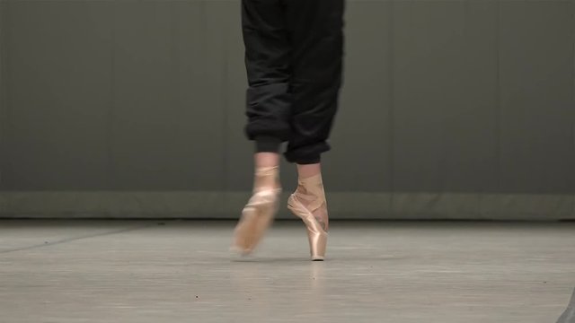 Feet of the ballerina during the ballet  rehearsal.