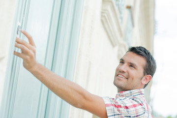 Man ringing at a door