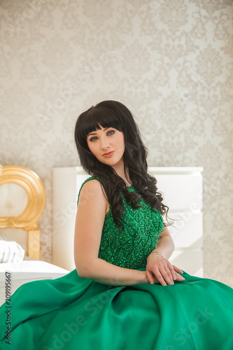 Beautiful Young Girl In A Smart Expensive Emerald Dress In