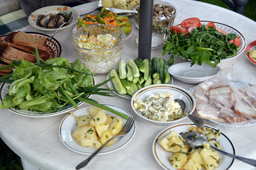 Fresh vegetables and snacks on the table at the cottage
