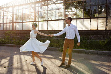 Young wedding couple enjoying romantic moments and dancing