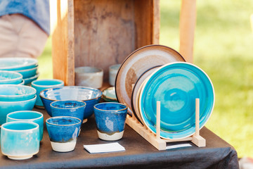 Handcrafted dishes and cups for sale at local market