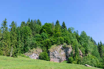 Huge, tree-covered rocks, red and white limestone, Homole Gorge