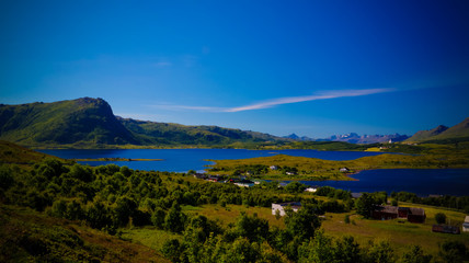 Fototapeta premium Panoramic view to Bostad village and Borgpollan fjord from Torvdalshalsen viewpoint at Vestvagoy Island, Lofoten, Norway