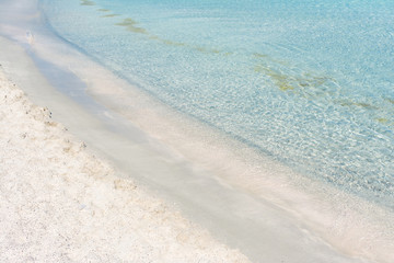 the edge of the shore with pink sand at Elafonisi beach in Crete