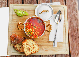 Traditional Hungarian goulash soup with a beautiful serving in the national restaurant. The concept...