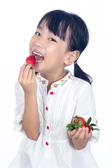 Asian Little Chinese Girl Eating Strawberry