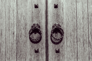 wooden door with forged handles