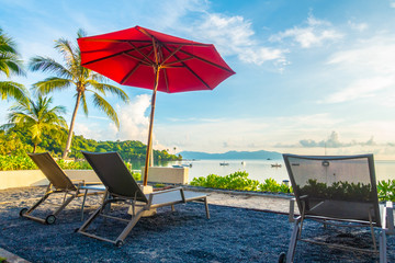 Beautiful tropical sea ocean and beach with umbrella and chair
