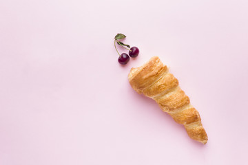 Custard cakes with cherries on pink background. Selective focus. Copy space