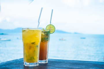 Ice mojito drinking glass with tropical sea ocean