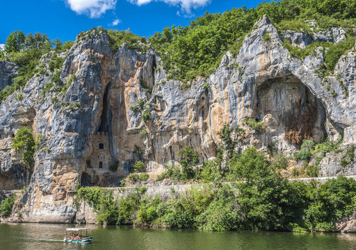 France, Lot, Causses du Quercy regional Natural park, tour boat on the Lot river in Bouzies and Chateau des Anglais inside the cliff (Hundred Years' War)