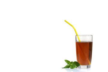 A glass of refreshing tea and mint leaves with an isolated background.