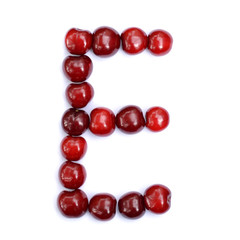 Letter E made with cherries to form a letter of the alphabet. Berry letters on a white background.