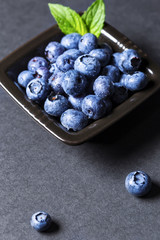 Fresh blueberries fruits on ceramic bowl.