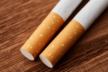cigarettes close-up on a wooden background. Drug addiction. Smoking of tobacco. cancer. Nicotine. Bad habit.