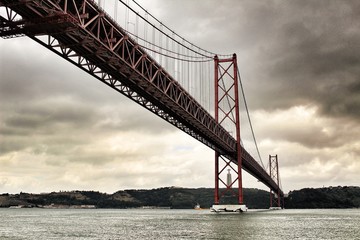 Fototapeta premium 25th April Bridge in Lisbon on a cloudy day
