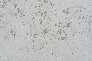 Wall fragment with scratches and cracks