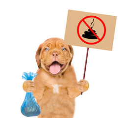 puppy holds plastic bag and sign 