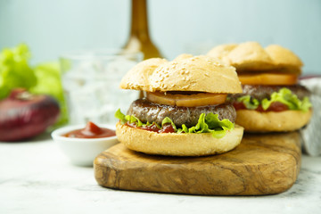 Beef burgers with tomato and lettuce