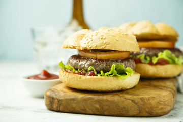 Beef burgers with tomato and lettuce