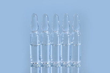 A vial (ampoule, container) with a drug (medicine) on a white background.