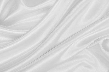 Fototapeta na wymiar Smooth elegant white silk or satin luxury cloth texture as wedding background. Luxurious Christmas background or New Year background design