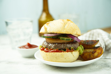 Beef burger with red onion, tomato, cucumber and fried