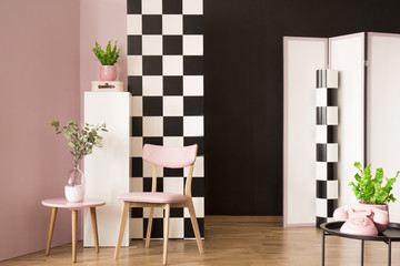 Pink room with checkerboard wall