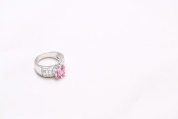 pink gem stone on diamond ring