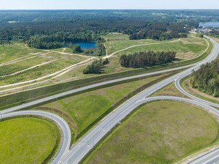 Fototapeta na wymiar road junction in the countryside aerial view in the form of butterfly