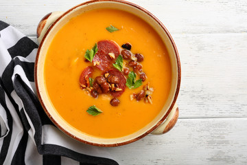 Hot pumpkin soup with chorizo and beans