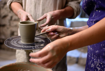 Fototapeta na wymiar Team work (and training) in pottery