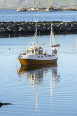 boat at midnight sun at Eggum at Lofoten in Norway