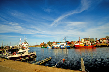 Fishing port of Ustka with old lighthouse
