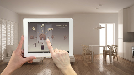Smart remote home control system on a digital tablet. Device with app icons. Minimalist modern...
