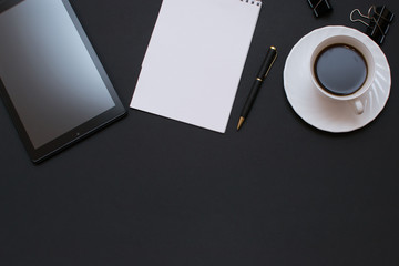 Blank notebook with pen is on top of office desk table.