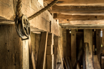 Vintage pulley and rope in old barn