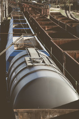 Old rusty cargo trains waiting to renovation.