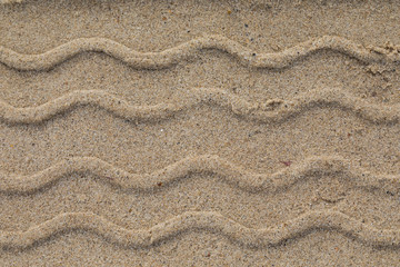 Driving on a sandy beach: tracks left behind