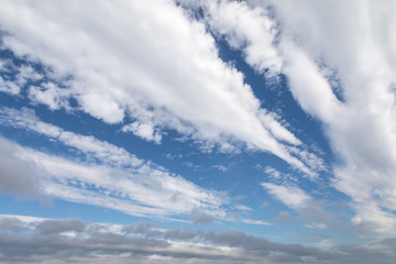 Fast-moving white and grey clouds