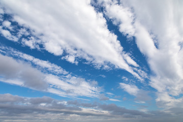 Fast-moving white and grey clouds