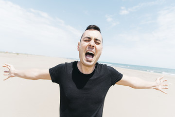 caucasian man screaming outdoors