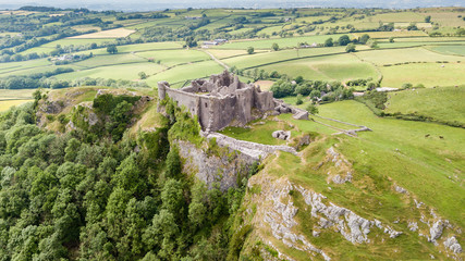 Aerial view of the ruins of Carreg Cennen Castle in the Camarthenshire countryside