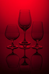 Four a glass on a red background.